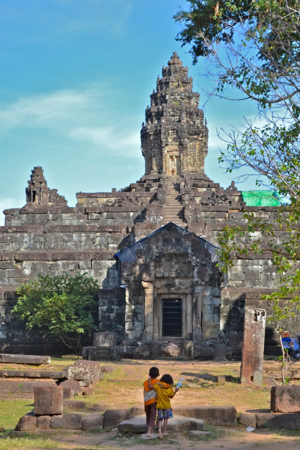 Two Cambodian children taking in the view of Bakong Temple thumbnail