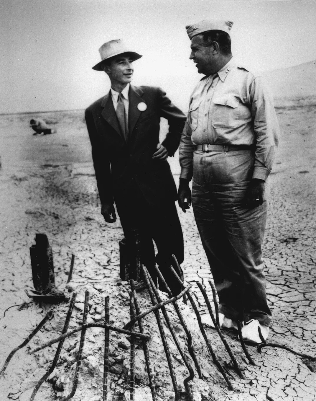 Oppenheimer (left) and General Leslie Groves (right) at ground zero of the nuclear bomb test site