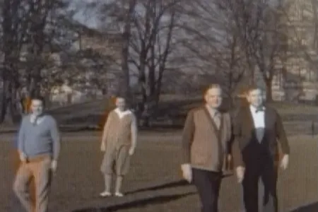 President Herbert Hoover (center right) plays a rousing game of Hooverball on the South Lawn of the White House. 