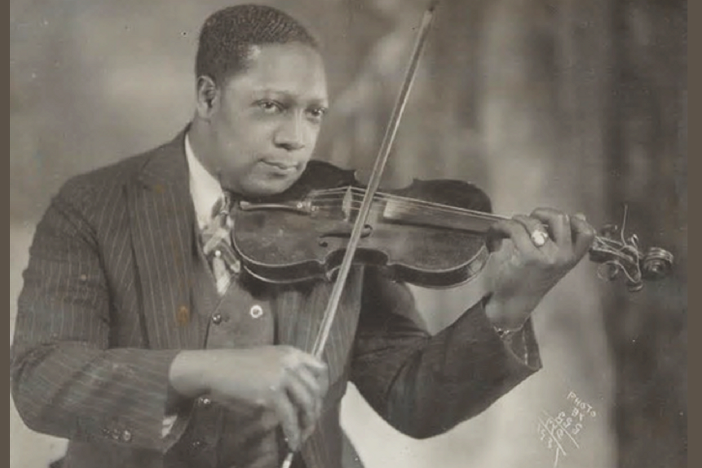 Photographer James Van Der Zee playing violin