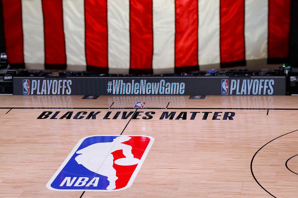 An empty court and bench seen shortly after the intended start of an NBA basketball playoff game between the Milwaukee Bucks and the Orlando Magic on Wednesday, Aug. 26. 