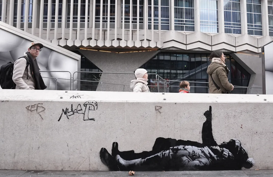 Banksy Confirms New London Statue of Flag-Blinded Man Stepping Off Pedestal — image 3