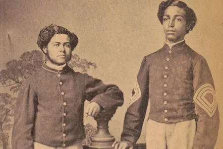 Sergeant Major William L. Henderson and hospital steward Thomas H.S. Pennington of the 20th U.S. Colored Troops Infantry Regiment, as photographed by W.H. Leeson