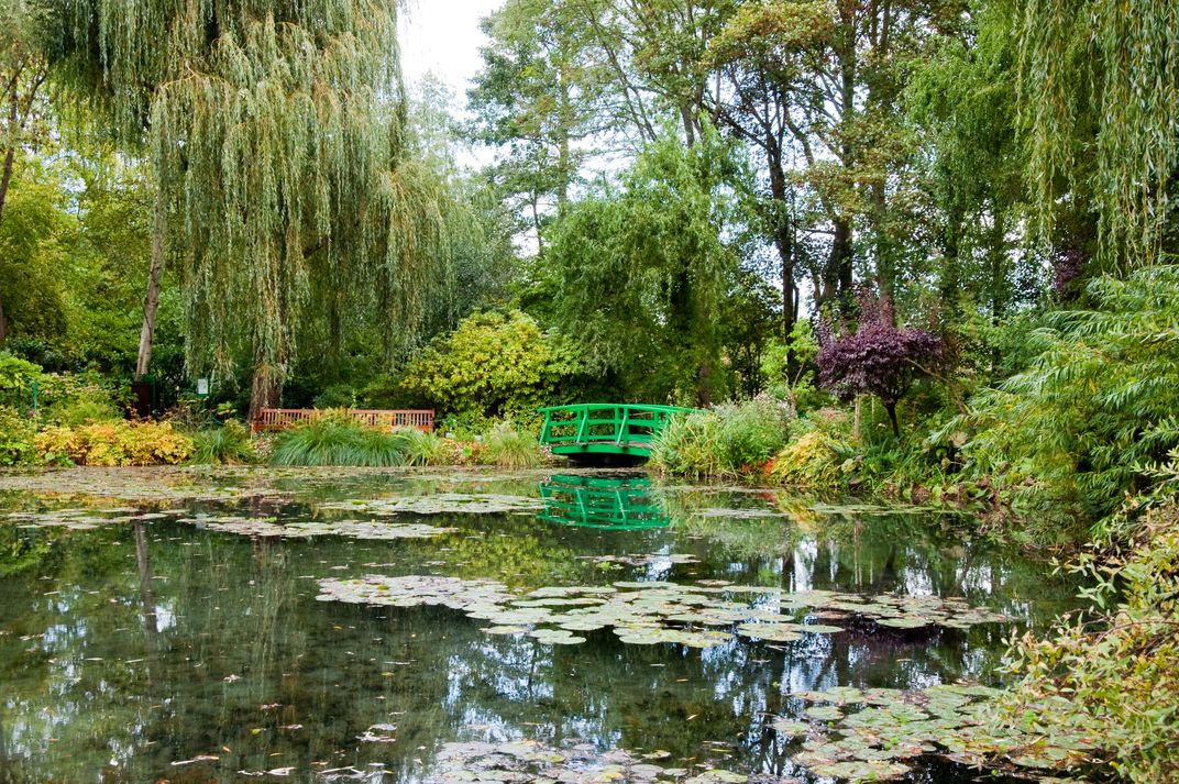 Monet's garden with the famous lily pads and green bridge at Giverny