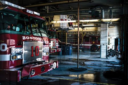 Poles like these at a Boston fire station are no longer used universally, but they remain emblematic of the profession.