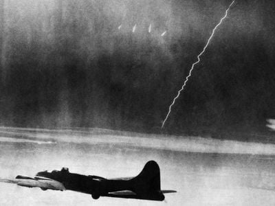 A V-2 streaks by a B-17 at high altitude. Not surprising that we found no similar photo of a B-24.