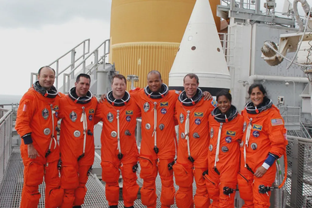 The crew of STS-116 prepares for their December 7 space shuttle launch.