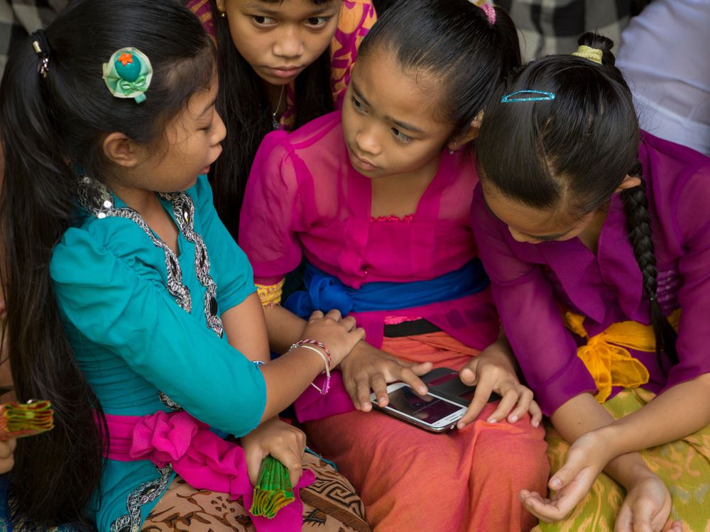 Girls Playing With Mobile Phone