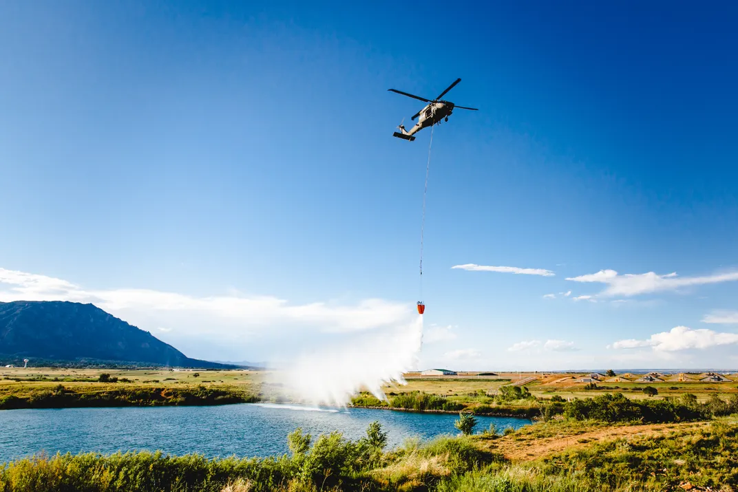 3 - Black Hawk pilots at Fort Carson train with Bambi Buckets, invented to transport water to fight large fires.