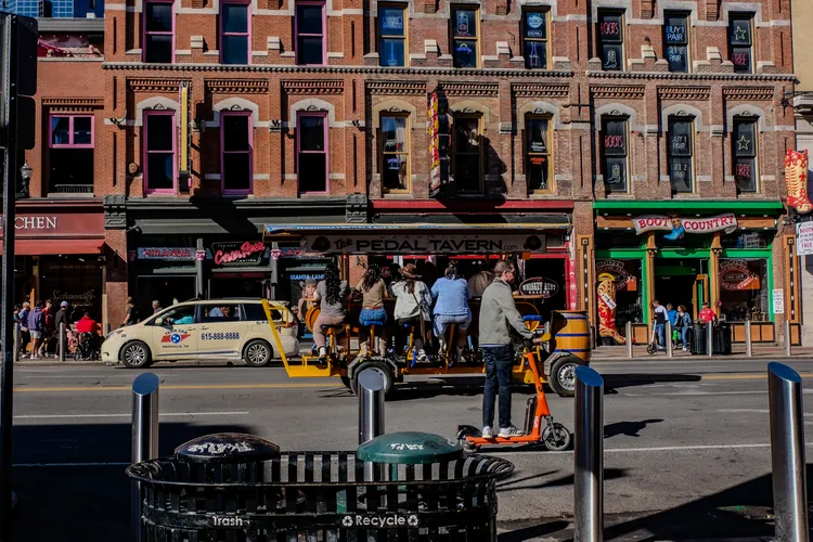 A man on a scooter in the street