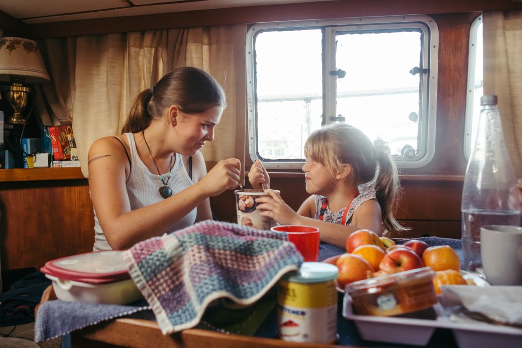 11 - The apples can wait. When you’re with your sister aboard a yacht, it calls for a treat—like a tub of ice cream.