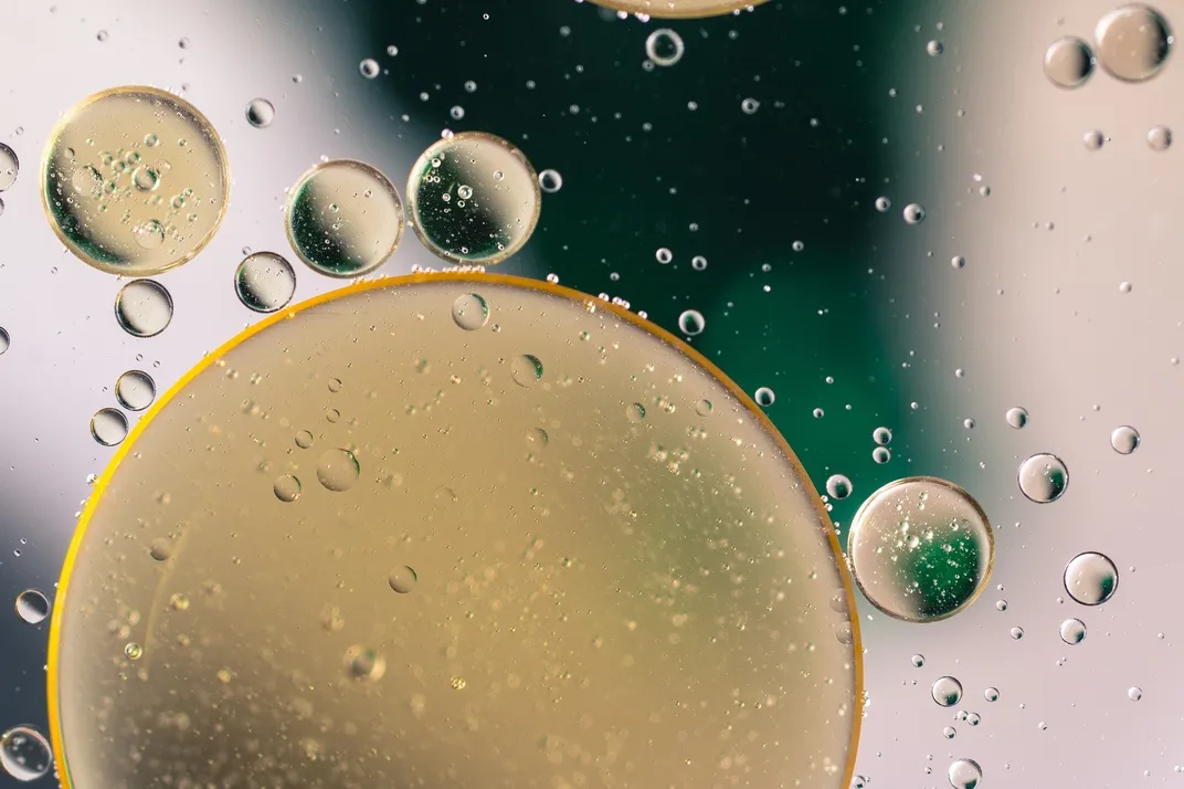 Tan oil droplets in water