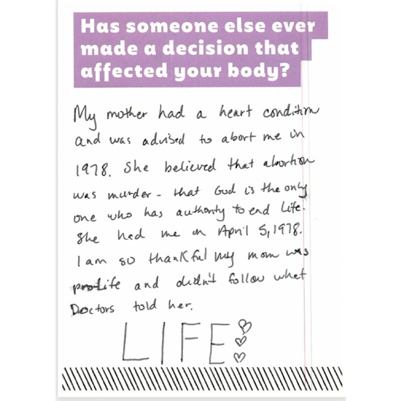 One card where a visitor shared a personal story about her mother and her mother's choice not to have an abortion. She expressed gratitude and ended with the word "LIFE."