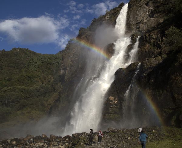 A rainbow in front of waterfalls thumbnail