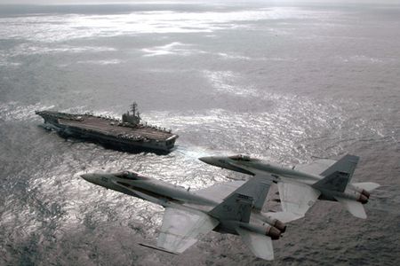 A pair of Hornet pilots hold a change of command ceremony in the sky.