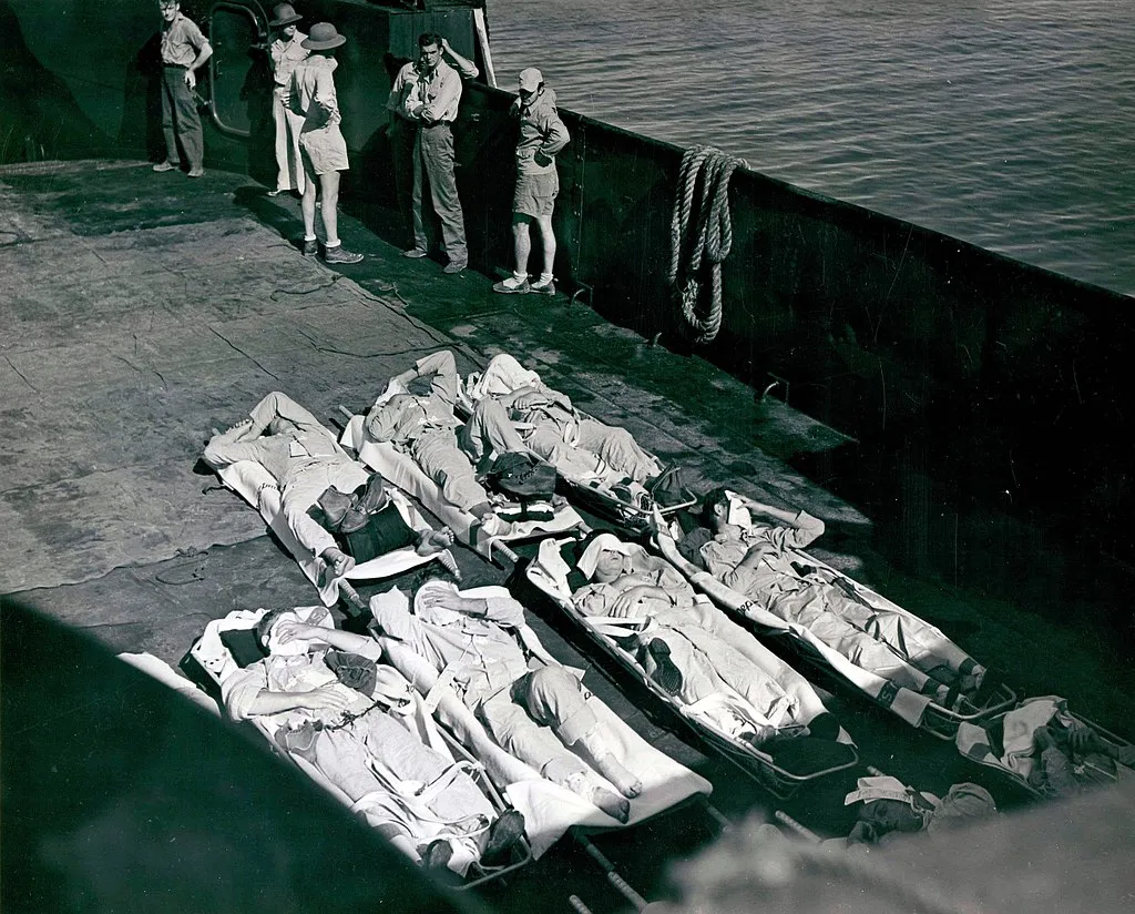 A landing craft transports survivors of the Indianapolis ashore for hospitalization on the island of Peleliu