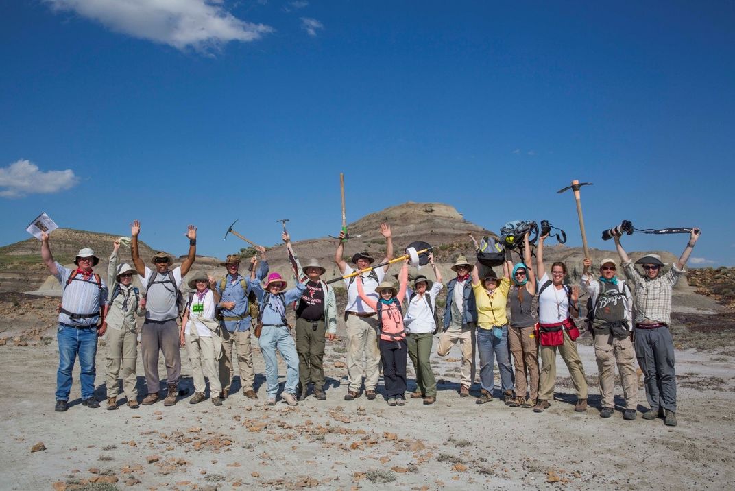 Group of Smithsonian scientists and experts conducting field work in the flat plains of North Dakota