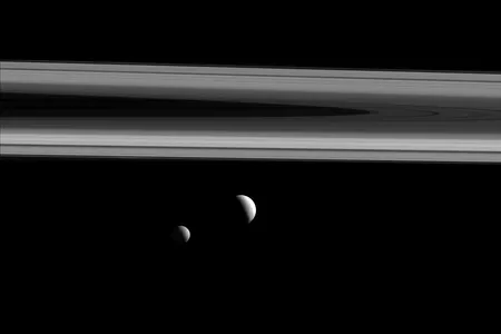 NASA's Cassini spacecraft captures three of Saturn's moons—Tethys, Enceladus and Mimas—in this group photo.