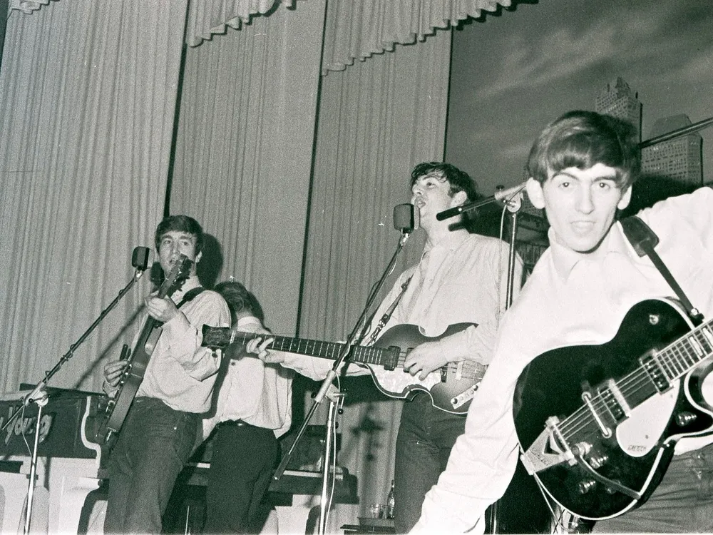 John Lennon, Paul McCartney and George Harrison perform at the Star-Club in Hamburg, Germany, in May 1962