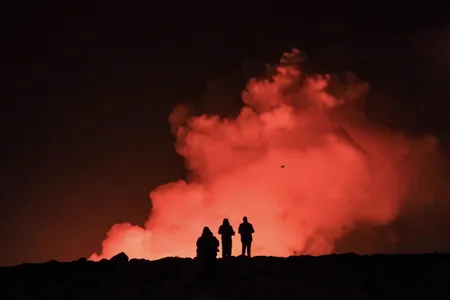 People watch Thursday's volcanic eruption in Iceland. The Icelandic Meteorological Office said Friday afternoon local time that there were no more signs of eruptive activity.
