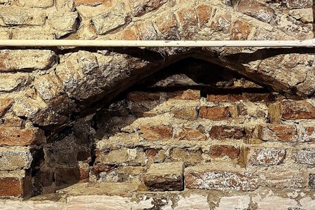 The medieval archway was buried beneath layers of plaster and brick.
