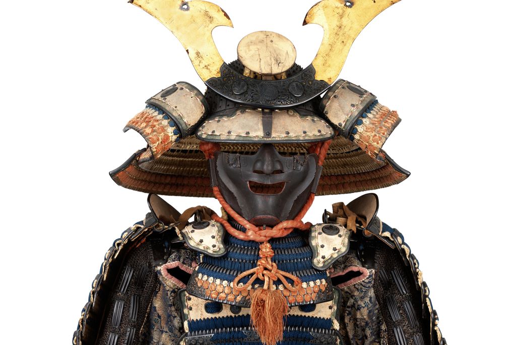 OPENER DETAIL - This suit of  armor bears the crest of the powerful Ikeda family. The helmet dates to the 14th century, and the suit—including the bear-fur shoes—dates to the 18th.