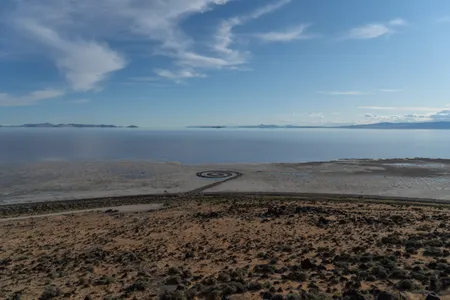 Robert Smithson, Spiral Jetty (1970). Great Salt Lake, Utah, USA. Mud, precipitated salt crystals, rocks, water. 1,500 ft. (457.2 m) long and 15 ft. (4.6 m) wide. Collection Dia Art Foundation. Photograph: William T. Carson, 2020