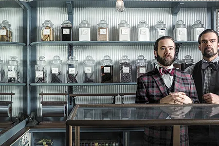 Eric, left, and Ryan Berley serve up handmade jellies, nut clusters, walnut pillows, nonpareils and other goodies.