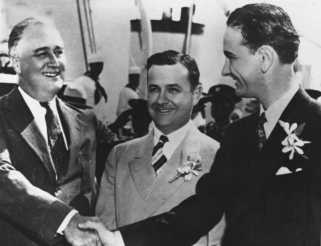 Franklin Delano Roosevelt (left) shakes hands with a young LBJ (right) in 1937.