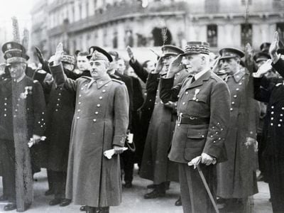 Spanish dictator Francisco Franco (left) and Philippe Petain (right), head of state for Vichy France, salute during the French national anthem during a meeting in Montpelier, France, March, 1941.