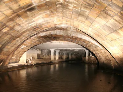 An 800-year-old medieval bridge spans the subterranean River Roch beneath Rochdale, England.