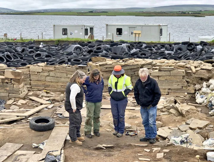 Archaeologists with post-holes