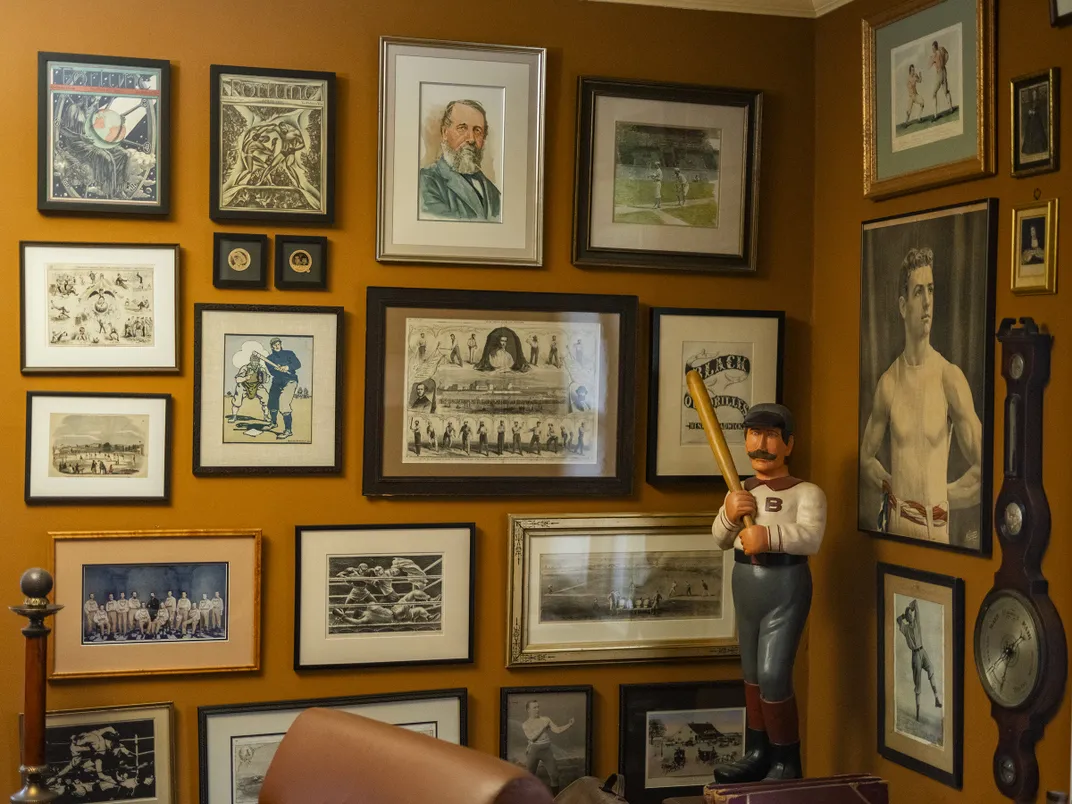 a room with baseball memorabilia and photographs