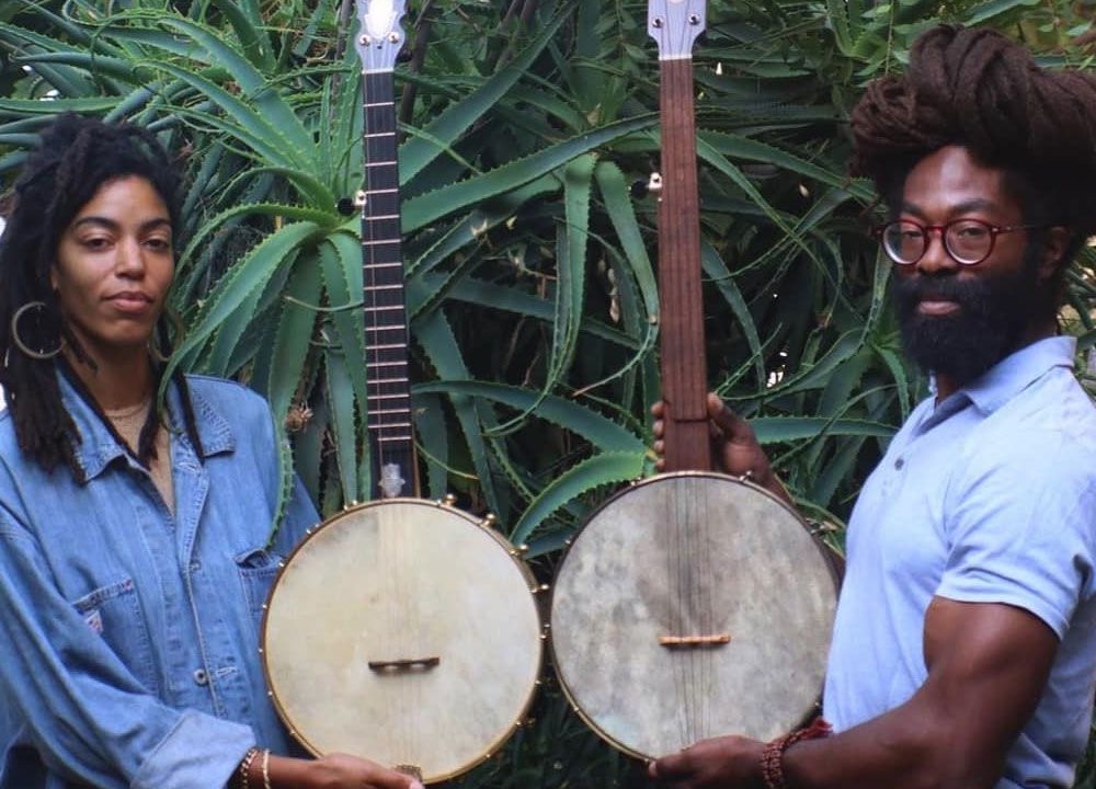 Black Banjo Reclamation Project founders Hannah Mayree and Carlton “Seemore Love” Dorsey, with banjos made by Brooks Masten of Brooks Banjos in Portland, Oregon. (Photo by Avé-Ameenah Long)