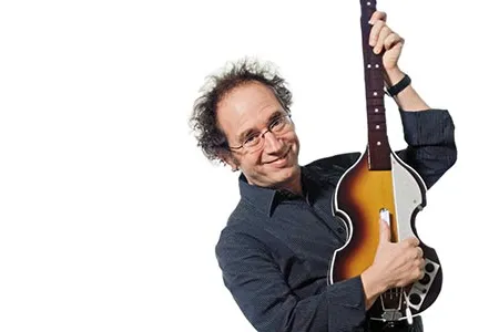 "Kids have fantastic ideas," says "wired composer" Tod Machover, holding an instrument from the Beatles version of Rock Band, the computer-based musical toy invented by his students at MIT.