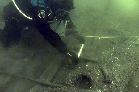 Tim Caza assesses the boat. 