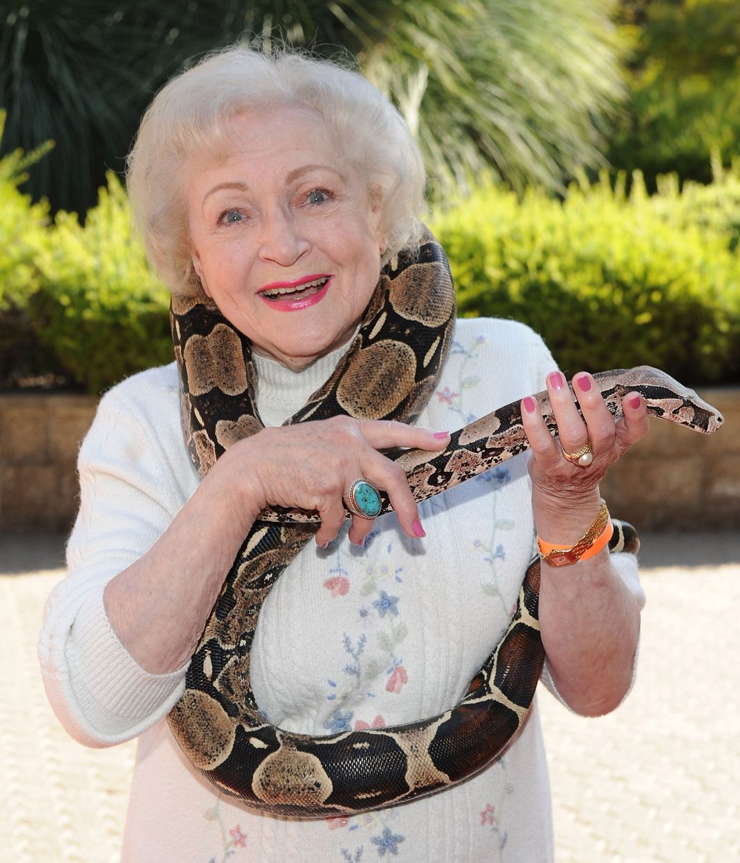 Betty White holds a snake