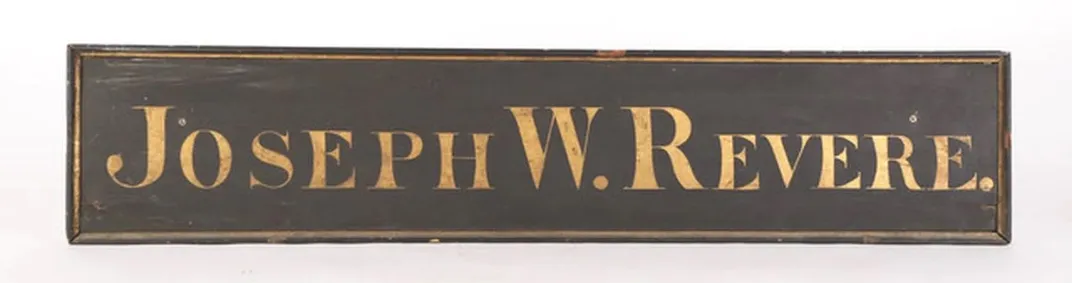 A trade sign with gold leaf lettering bearing the name of Joseph W. Revere