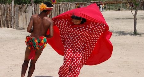 Two Wayuu dancers from La Guajira Province in northern Colombia perform a courtship dance.
