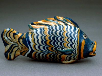 This glass fish was found in a fairly modest private house in Amarna, buried under a plaster floor along with a few other objects. It may once have contained ointment.