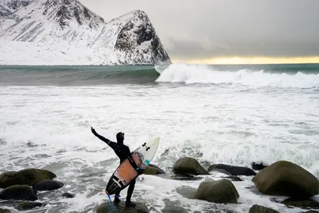 Pat Millin eyes an unridden Arctic wave moments before he paddles out