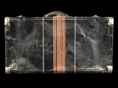 This black metal suitcase belonged to Iku Tsuchiya. It went with her to Tanforan Assembly Center, then to the Topaz camp, and back home to San Leandro, California. (NMAH)
