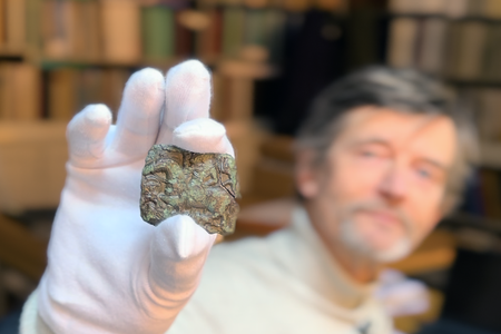 Peter Pentz, a curator at the National Museum of Denmark, sees many similarites between the stamp and the Sutton Hoo helmet.