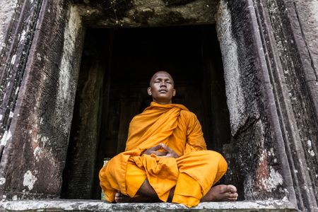 A Buddhist monk meditates in Cambodia.