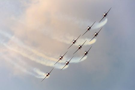 The Royal Canadian Air Force Snowbirds fly in formation in front of a passing storm in 2015. 