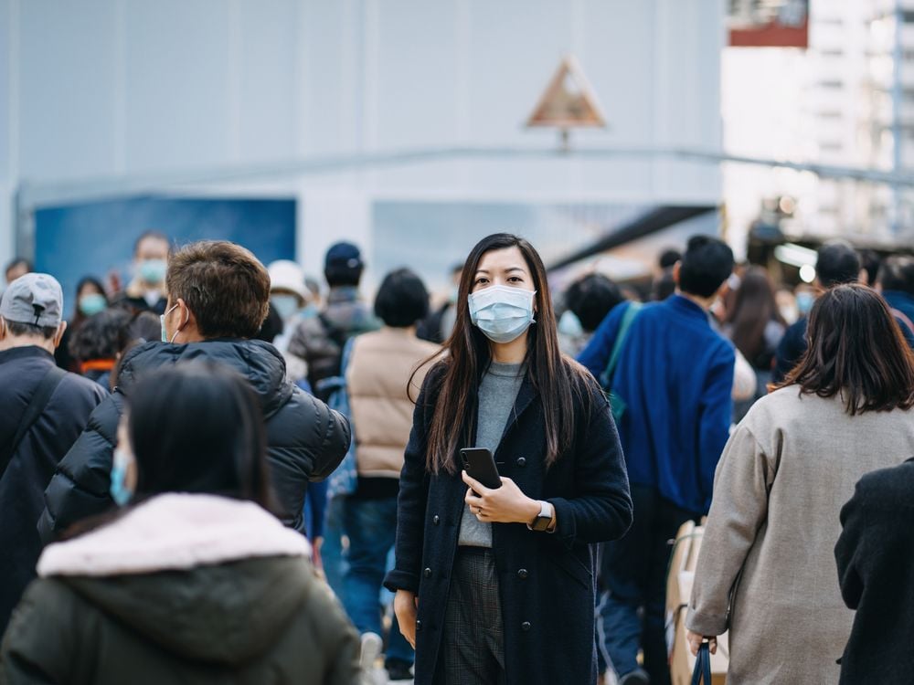 woman masked in crowd