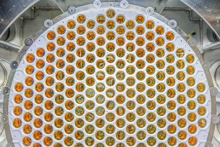 If a theoretical dark matter particle interacts with liquid xenon in an underground tank, these light sensors should detect the resulting flash of light.&nbsp;