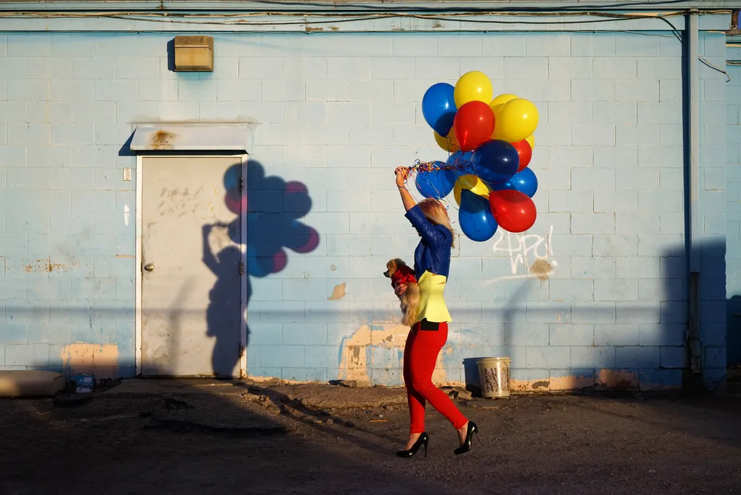 Woman dog and balloons