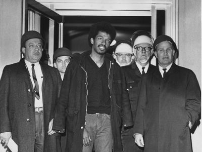 Cleveland Sellers, center, stands with officers after his arrest in Orangeburg, S.C., where three were killed and 28 others wounded on Feb. 8, 1968.