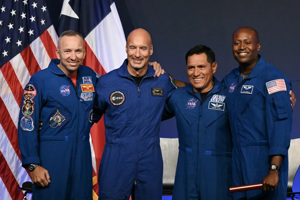the crew of Artemis iii stands together and smiles at a news conference